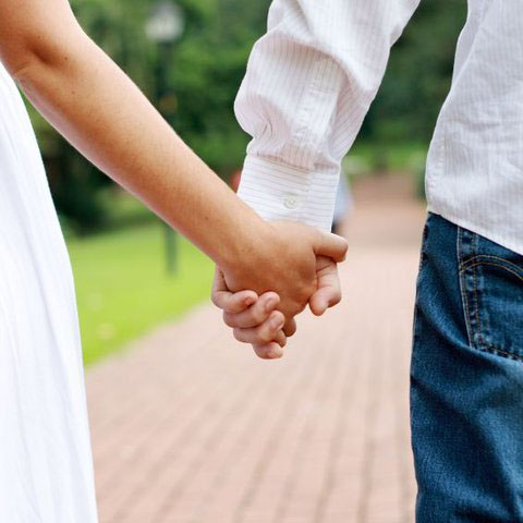 Close up of a couple holding hands